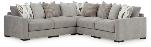 Ashley Furniture Aslan Court Sectional sofa with plush cushions and modern design in a cozy living room setting.