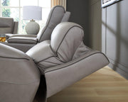 Ashley Furniture 5Z-Comfort living room set featuring a sofa and loveseat with plush cushions and neutral fabric upholstery.