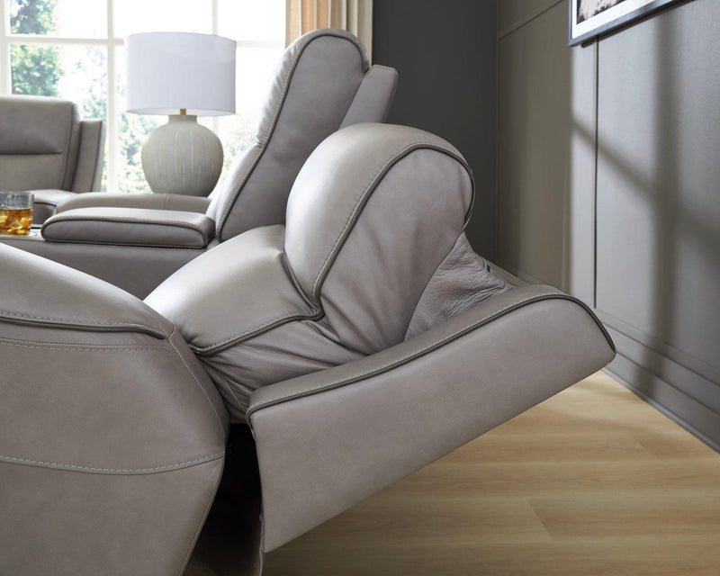 Ashley Furniture 5Z-Comfort living room set featuring a sofa and loveseat with plush cushions and neutral fabric upholstery.