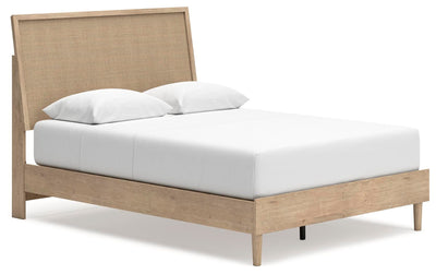 Ashley Furniture Cielden bed with a wooden frame and neutral bedding, shown from an angled view in a modern bedroom setting.
