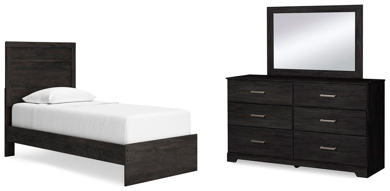 Ashley Furniture Belachime bedroom set with a bed, dresser, and nightstands in a modern design, shown in a cozy bedroom setting.