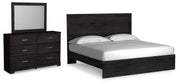 Ashley Furniture Belachime bedroom set with a bed frame, nightstands, and dresser in a modern, elegant bedroom design.