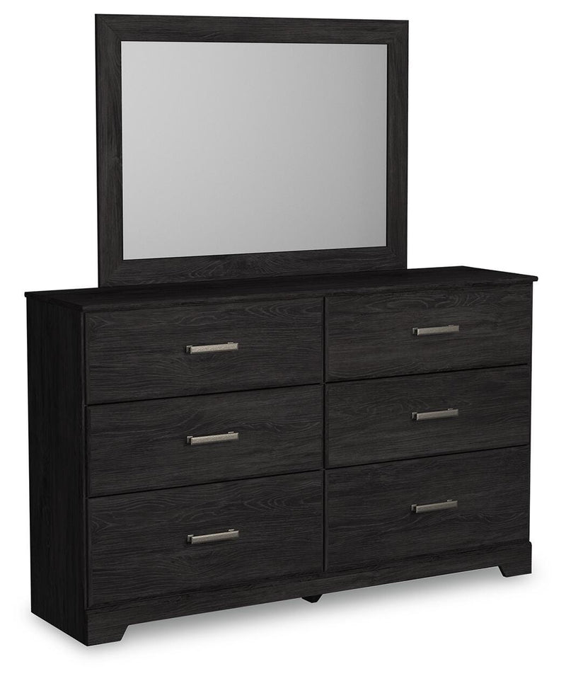 Ashley Furniture Belachime bedroom set shown from an angle, featuring a modern bed frame, nightstands, and matching bedroom furniture.