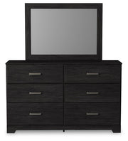 Ashley Furniture Belachime bedroom set featuring a modern bed frame with a padded headboard and matching nightstands.