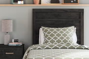 Ashley Furniture Belachime bedroom set featuring a bed, matching dresser, and nightstands in a modern bedroom design.