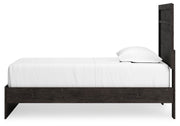 Ashley Furniture Belachime bedroom set featuring a bed frame, nightstands, and dresser in a modern bedroom design.