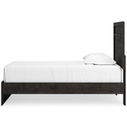 Ashley Furniture Belachime Bed with a sleek wooden frame and side view, showcasing modern bedroom furniture design.