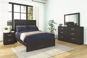 Ashley Furniture Belachime bedroom set with a modern bed frame, matching nightstands, and dresser in a cozy bedroom scene.