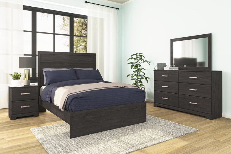 Ashley Furniture Belachime bedroom set with a modern bed frame, matching nightstands, and dresser in a cozy bedroom scene.
