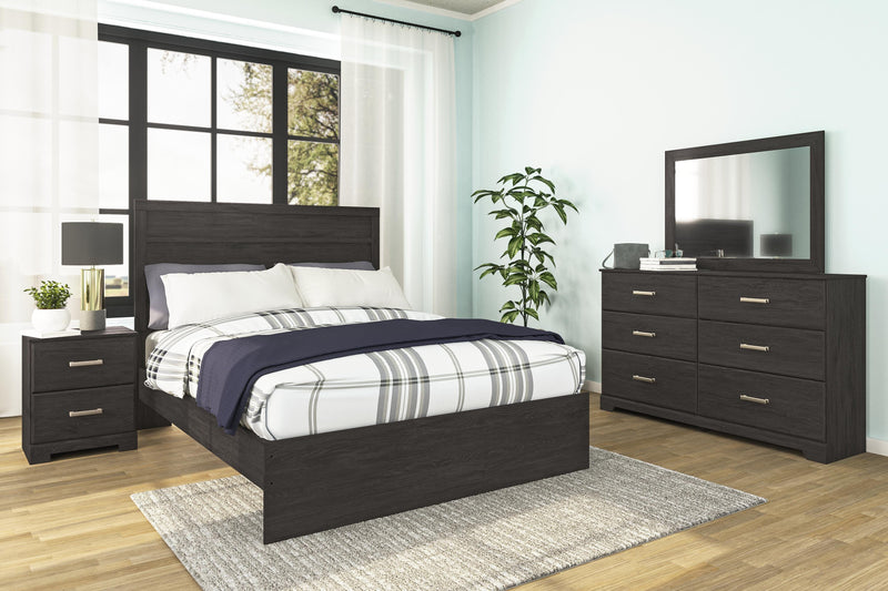 Ashley Furniture Belachime bedroom set featuring a bed frame, nightstands, and matching dresser in a modern design.