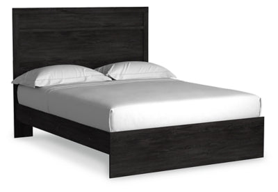 Ashley Furniture Belachime Bed with a stylish wooden frame, shown from a side angle highlighting its elegant design.