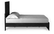 Ashley Furniture Belachime Bed with side view, showcasing the wooden frame and classic design for a cozy bedroom setting.
