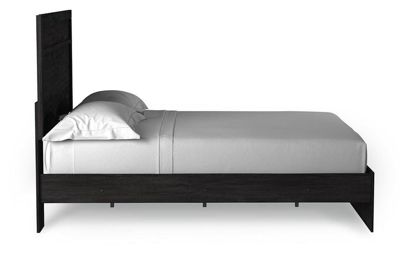 Ashley Furniture Belachime Bed with side view, showcasing the wooden frame and classic design for a cozy bedroom setting.