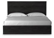 Ashley Furniture Belachime Bed with headboard featuring detailed woodwork and a rich finish, shown from a head-on view.