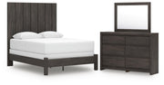 Ashley Furniture Fraluna bedroom set with a modern bed frame, matching nightstands, and dresser in a stylish bedroom setting.