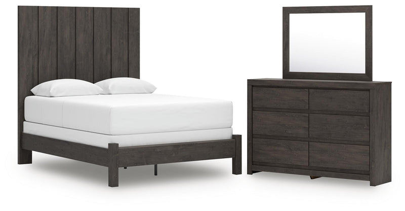 Ashley Furniture Fraluna bedroom set with a modern bed frame, matching nightstands, and dresser in a stylish bedroom setting.