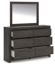 Ashley Furniture Fraluna bedroom set with a bed, nightstands, and dresser in a modern bedroom scene.
