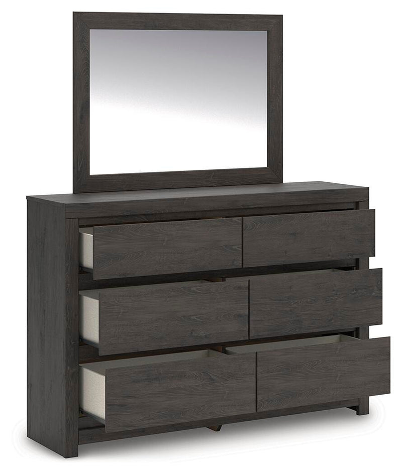 Ashley Furniture Fraluna bedroom set featuring a bed with a headboard, matching nightstands, and a stylish, modern bedroom design.