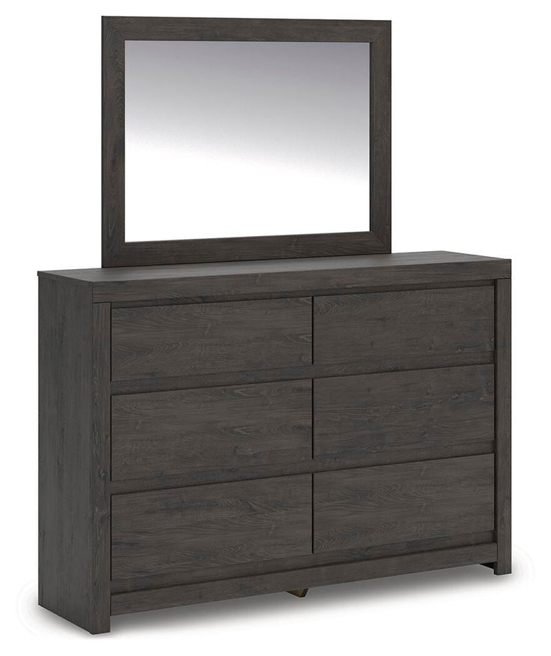 Ashley Furniture Fraluna bedroom set featuring a bed with a padded headboard and matching nightstands in a modern design.