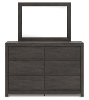 Ashley Furniture Fraluna bedroom set featuring a bed with a headboard, side tables, and coordinated bedroom furniture.