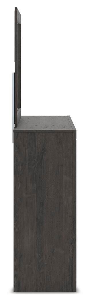 Ashley Furniture Fraluna bedroom set with a bed, nightstands, and matching dresser in a modern bedroom setup.