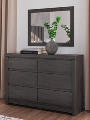 Ashley Furniture Fraluna bedroom set with a bed, nightstands, and dresser in a modern bedroom scene.