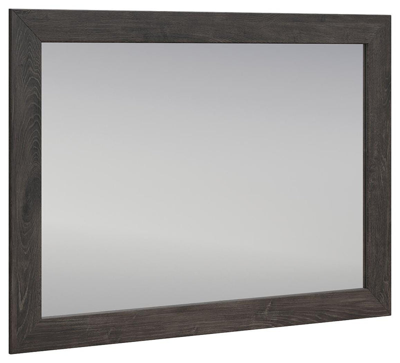 Ashley Furniture Fraluna bedroom mirror with a sleek, modern design, angled view showing its stylish frame and reflective surface.