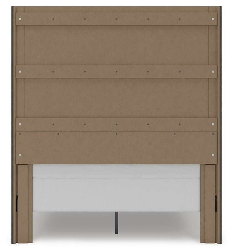Ashley Furniture Fraluna bedroom set with a large upholstered bed, matching nightstands, and a dresser in a modern bedroom design.