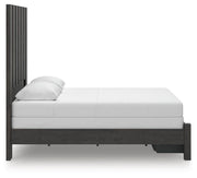 Ashley Furniture Fraluna bedroom set with a stylish bed frame, nightstands, and dresser in a modern bedroom design.