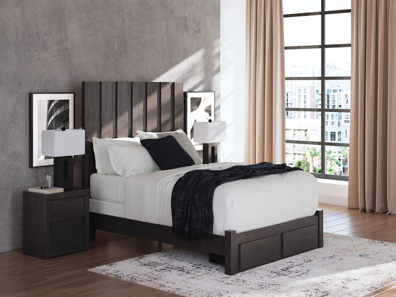 Ashley Furniture Fraluna bedroom set with a modern bed frame, matching nightstands, and a stylish dresser in a contemporary bedroom.