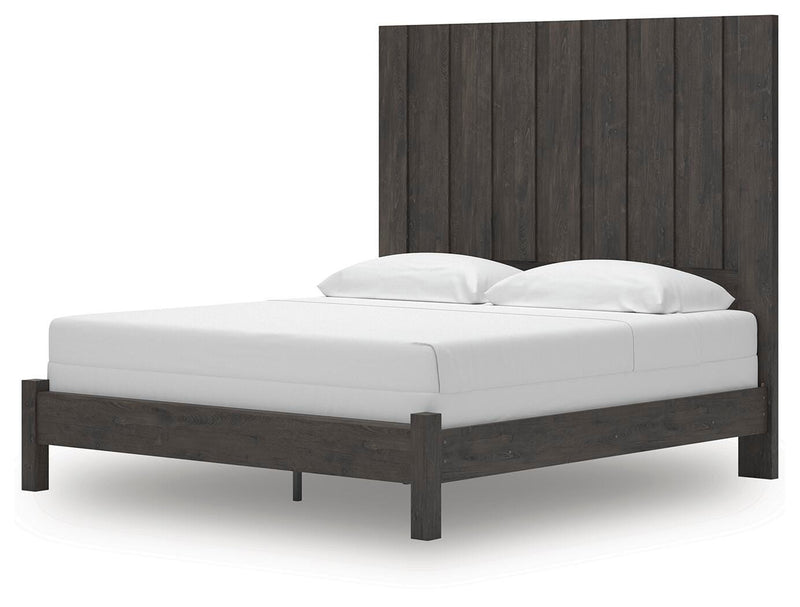 Ashley Furniture Fraluna bedroom set with a modern bed frame, matching nightstands, and a coordinated dresser in a stylish bedroom.