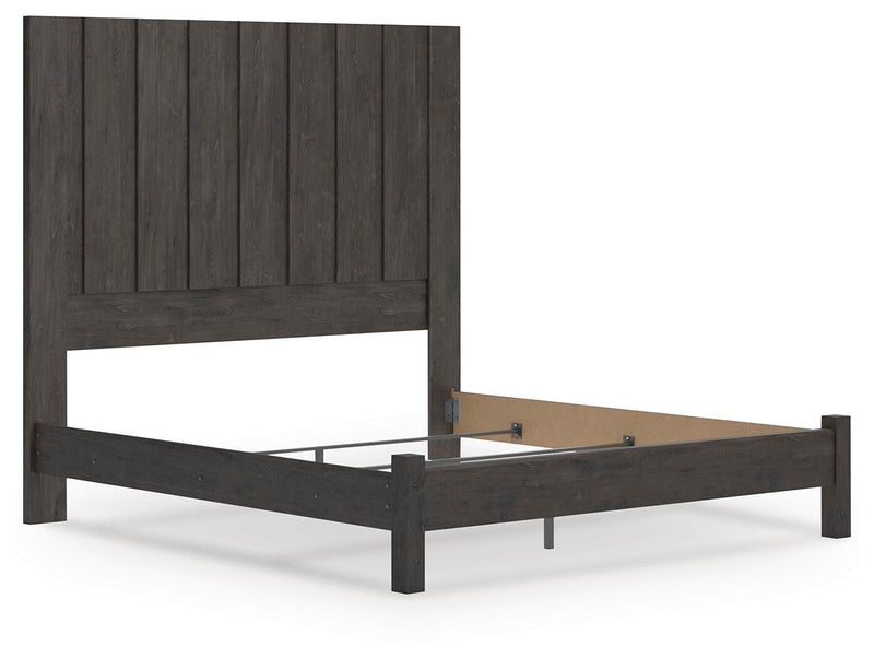 Ashley Furniture Fraluna bedroom set with a modern bed frame, matching nightstands, and a coordinated dresser in a stylish bedroom.