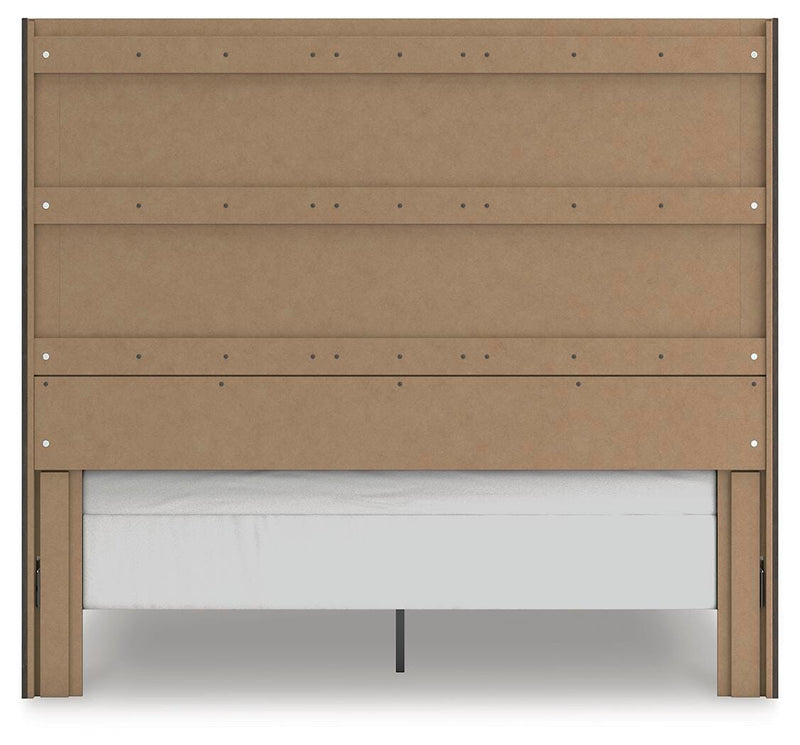 Ashley Furniture Fraluna bedroom set with a bed, nightstands, and dresser in a stylish, modern bedroom scene.