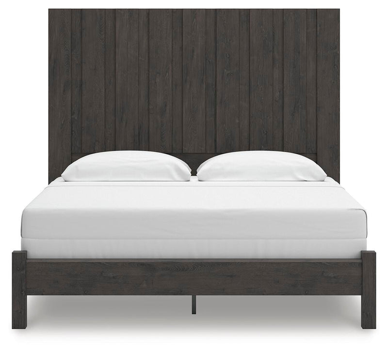Ashley Furniture Fraluna bedroom set featuring a bed with a dark wood finish and matching nightstands, head-on view.