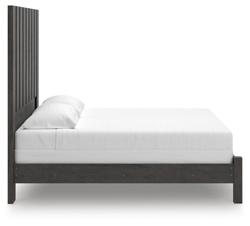 Ashley Furniture Fraluna bedroom set with a modern bed frame, matching nightstands, and stylish bedroom furniture in natural wood finish.