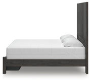 Ashley Furniture Fraluna bedroom set featuring a stylish bed with a matching nightstand and dresser in a modern design.