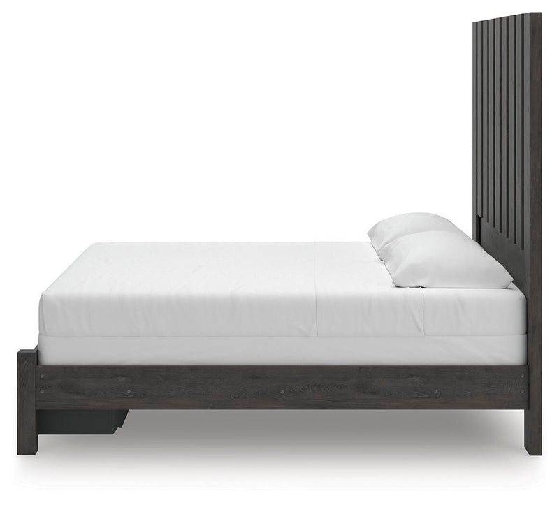 Ashley Furniture Fraluna bedroom set featuring a stylish bed with a matching nightstand and dresser in a modern design.