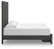 Ashley Furniture Fraluna bedroom set with a bed frame, matching nightstands, and modern design, shown from a side angle.