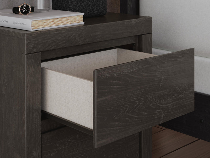 Ashley Furniture Fraluna bedroom set with a modern bed frame, nightstands, and dresser, featuring sleek wood finish and contemporary design.