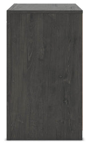 Ashley Furniture Fraluna bedroom set with a bed, nightstands, and dresser in a modern design, shown in a cozy bedroom setting.