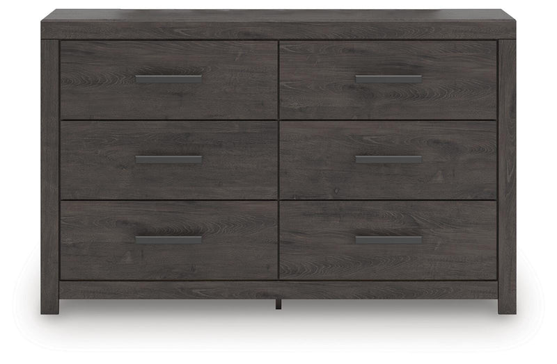 Ashley Furniture Prendonea dresser with sleek wood finish and modern design, featuring multiple drawers for ample storage.