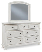 Ashley Furniture Robbinsdale bedroom set with a stylish bed, nightstands, and matching dresser, shown from an angled perspective.