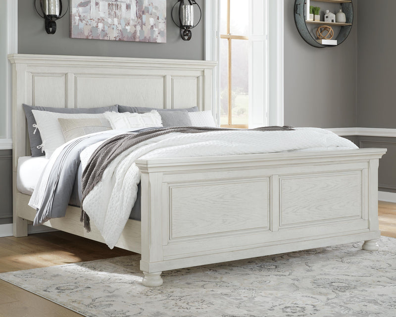 Ashley Furniture Robbinsdale bedroom set with a bed, nightstands, and dresser in a modern design, shown in a cozy bedroom setting.