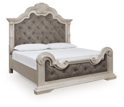 Ashley Furniture Bruchandi upholstered bed with a padded headboard, shown from an angled side view in a stylish bedroom setting.