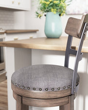 Ashley Furniture Caitbrook bar height bar stool with wooden legs and upholstered seat, perfect for kitchen or bar counter seating.