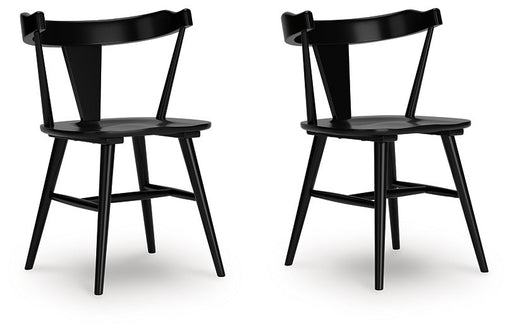 Ashley Furniture Gretlynn dining chair with upholstered seat and wooden legs, angled view showing elegant design and comfort.