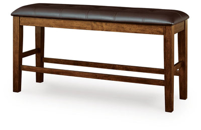 Ashley Furniture Ralene counter height dining bench with wooden legs and upholstered seat, angled view.