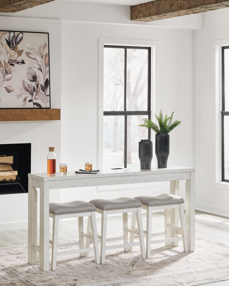 Ashley Furniture Robbinsdale counter height dining table with three matching barstools, featuring a modern wooden design.