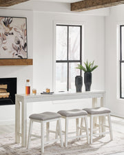 Ashley Furniture Robbinsdale counter height dining table with three matching barstools, featuring a modern wood finish and sturdy design.
