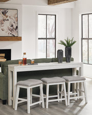 Ashley Furniture Robbinsdale counter height dining table with three matching barstools, featuring a wood finish and modern design.